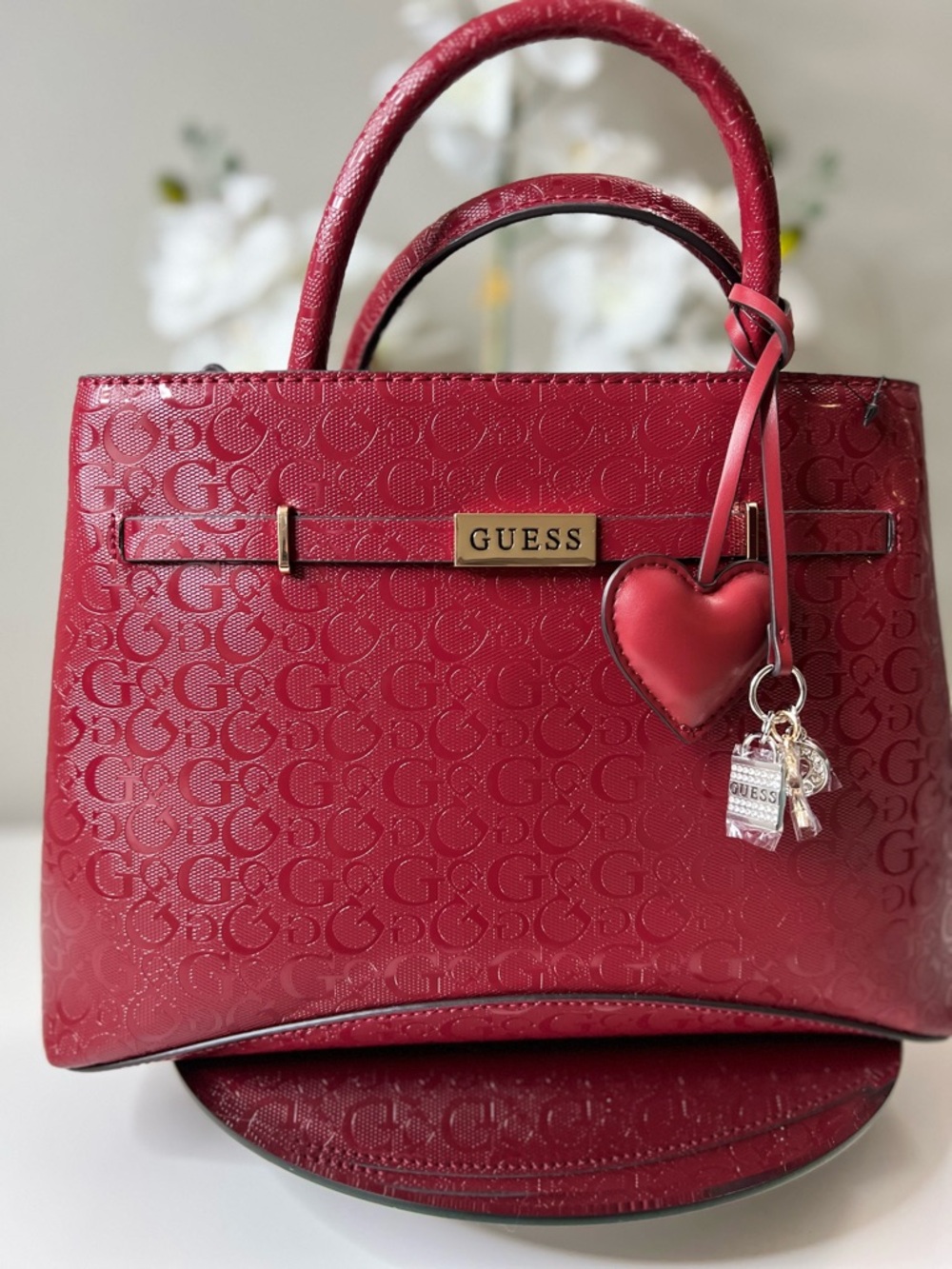 GUESS Jerica Cabernet  Embossed Logo Satchel with Heart Charm